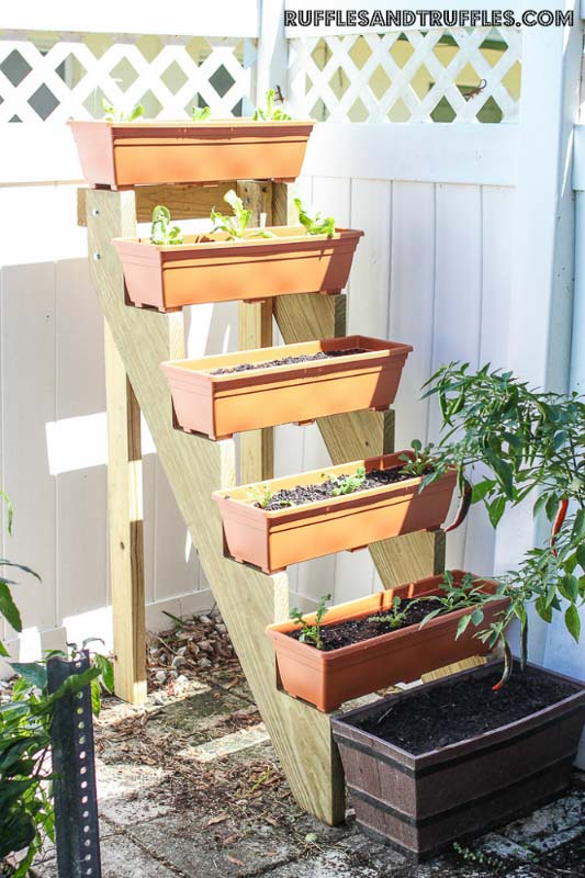 Smart and easy multi-tiered vertical garden made from a stair stringer.
