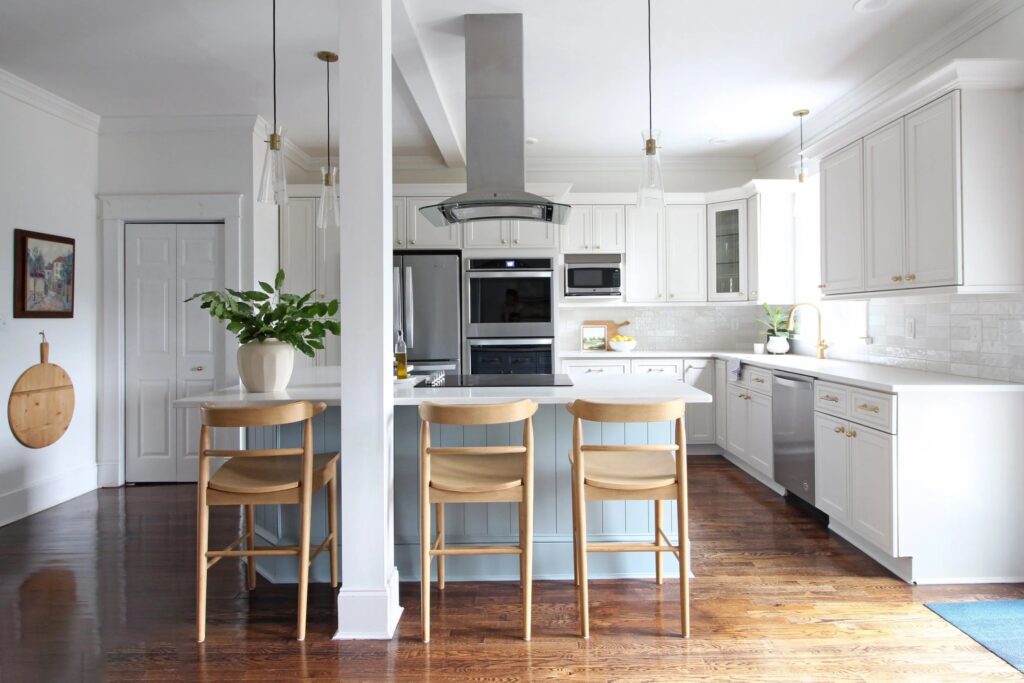 kitchen by Mix and Match Design, Chaney Widmer with SW Extra White walls, SW Breezy blue island and Ben Moore Pale Oak perimeter cabinets