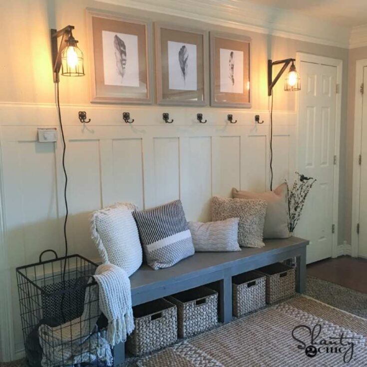 board and batten accent wall with hooks and bench