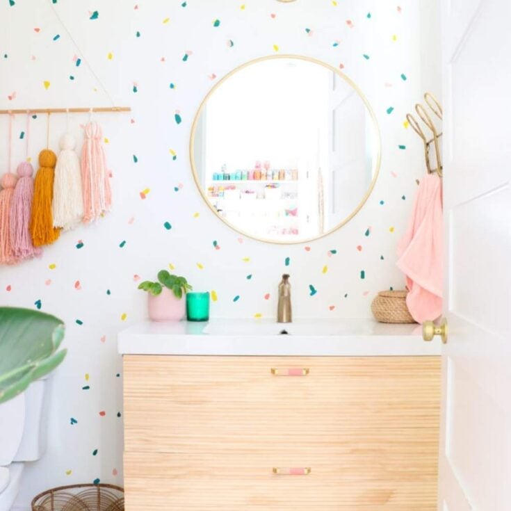 confetti painted accent wall in bathroom