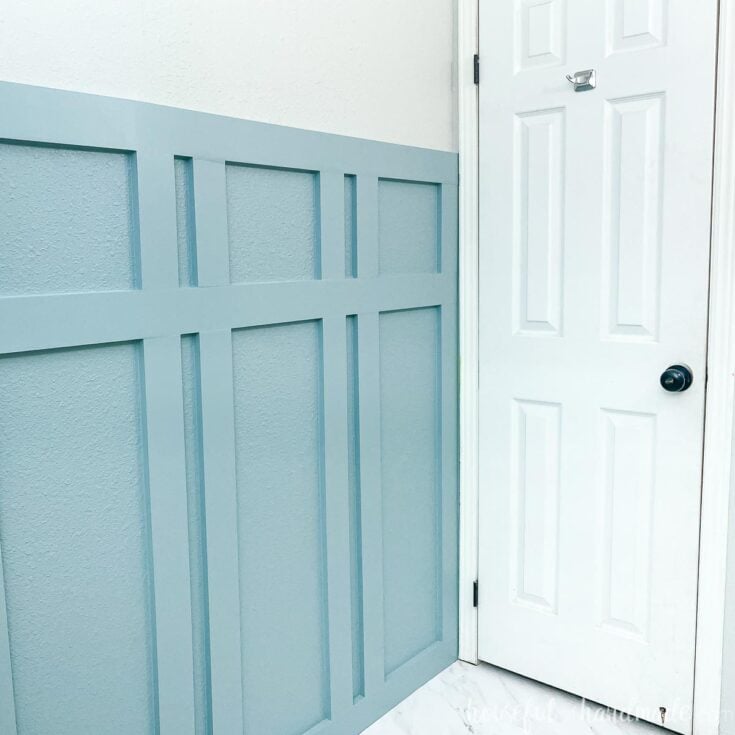 soft blue painted board and batten accent wall in bathroom