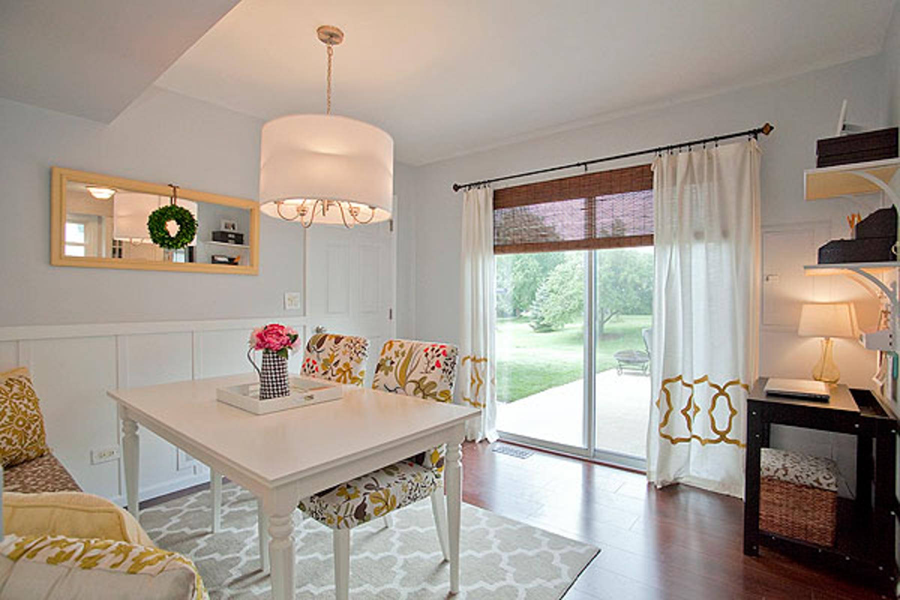 dining room space with white decor and furniture and Olympus White by Sherwin Williams on the walls