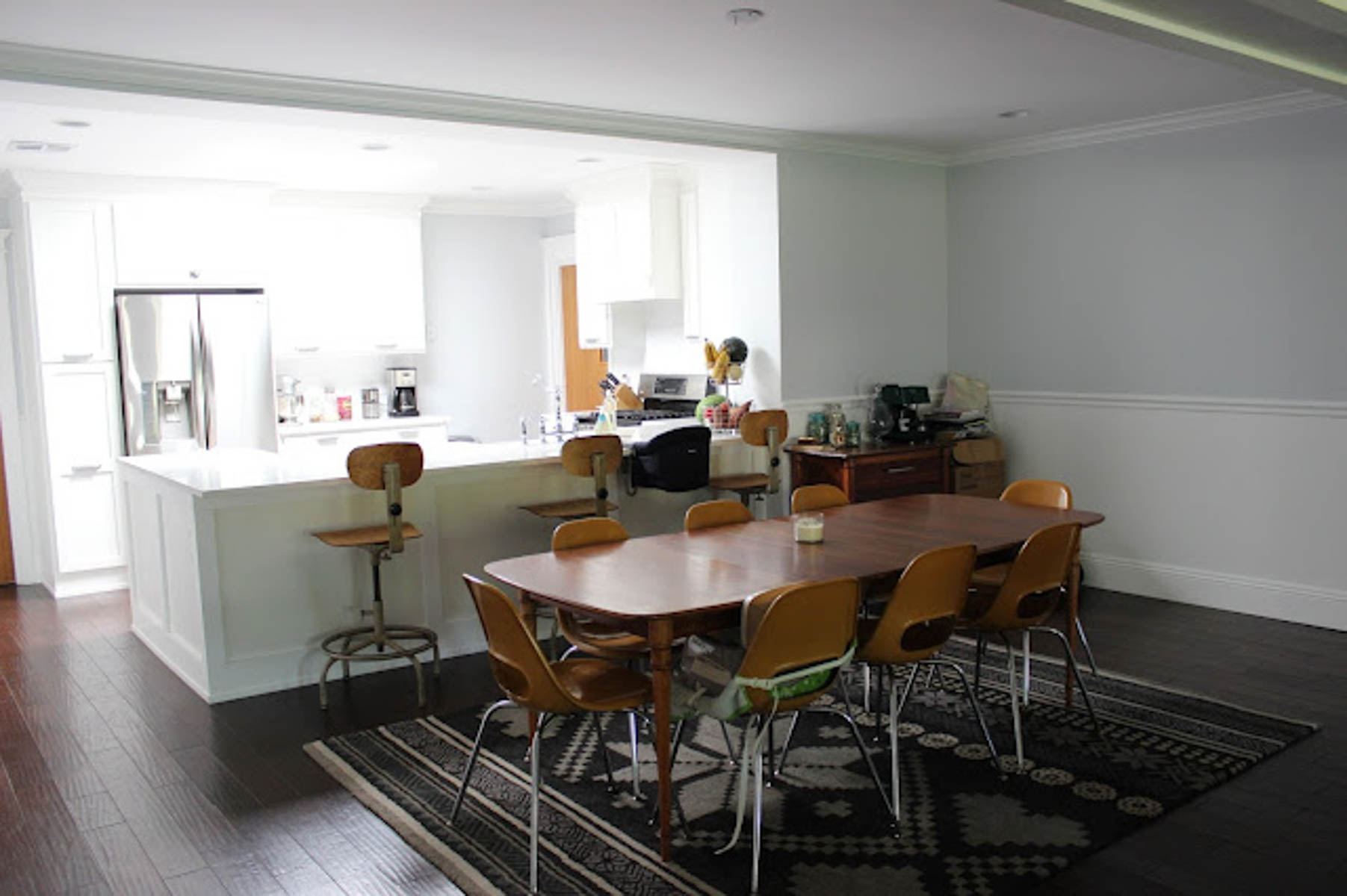 view from the dining nook of a small kitchen painted olympus white