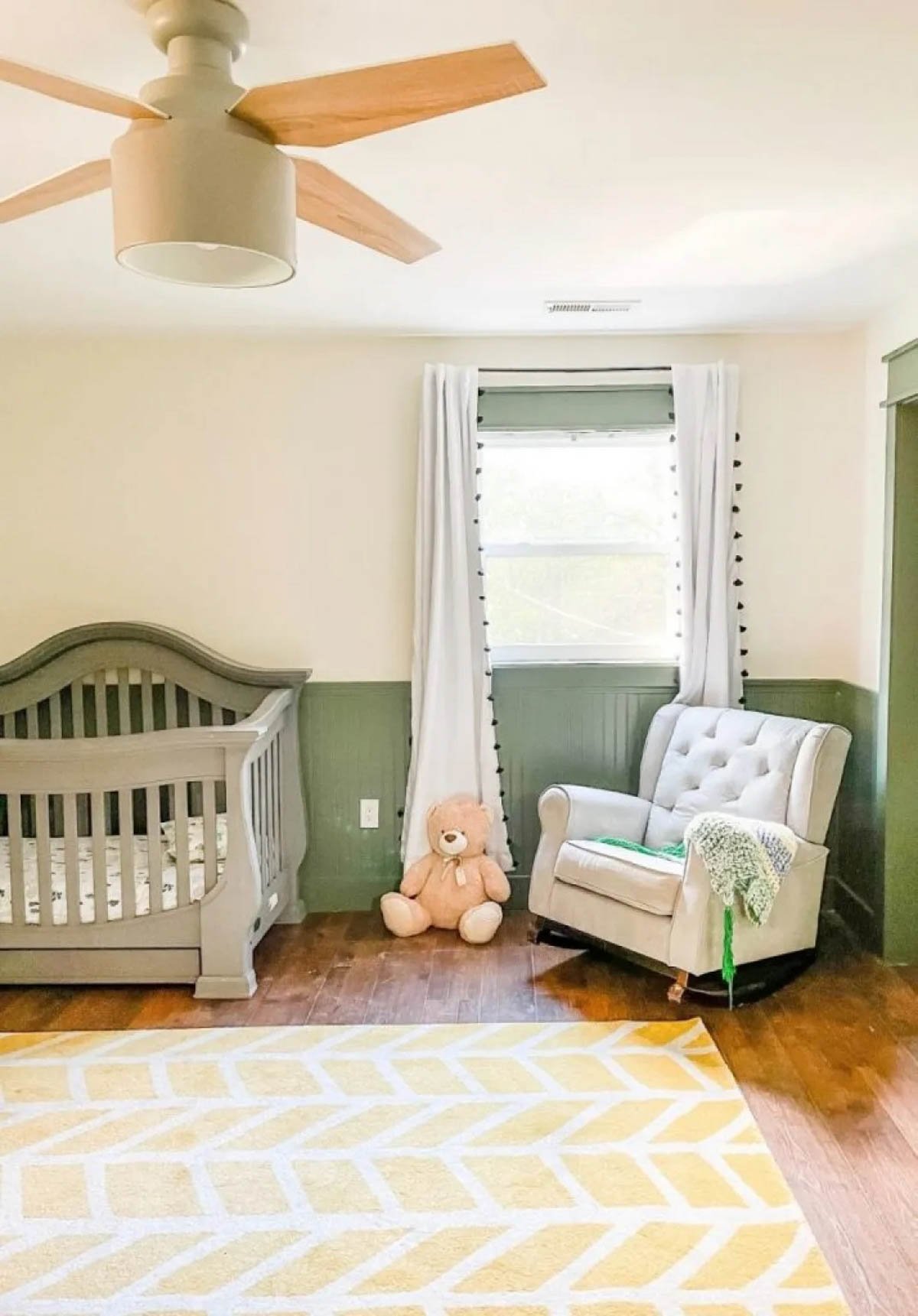 green painted moulding with off white half walls in a child's nursery