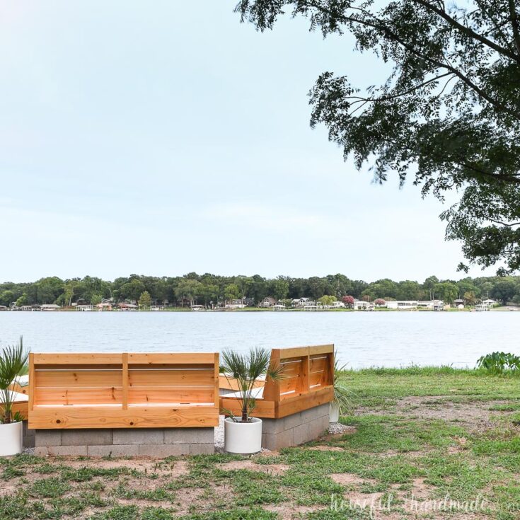 built in benches with fire pit on lake