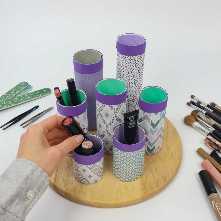 DIY makeup organizer on a lazy susan with upcycled paper towel rolls
