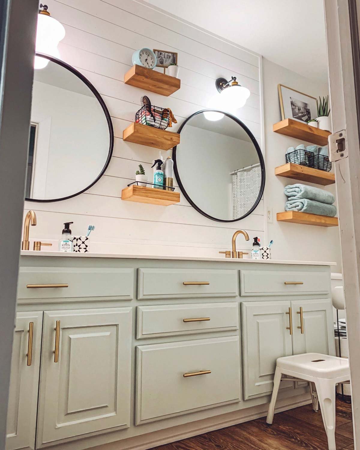 Sherwin Williams alabaster coordinating colors seen in bathroom with Sea Salt vanity against white shiplapped wall.