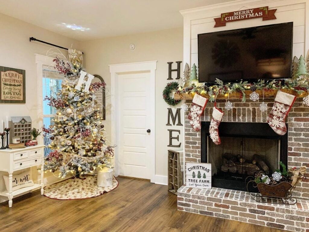 bending oak farmhouse living room decorated for Christmas with german smear fireplace, Christmas tree, and SW White Duck walls